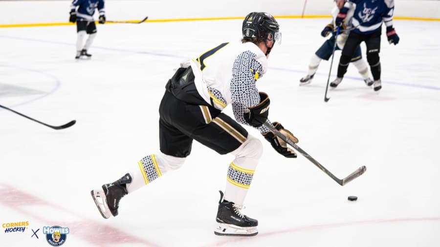 A Corners Hockey player winding up for a shot